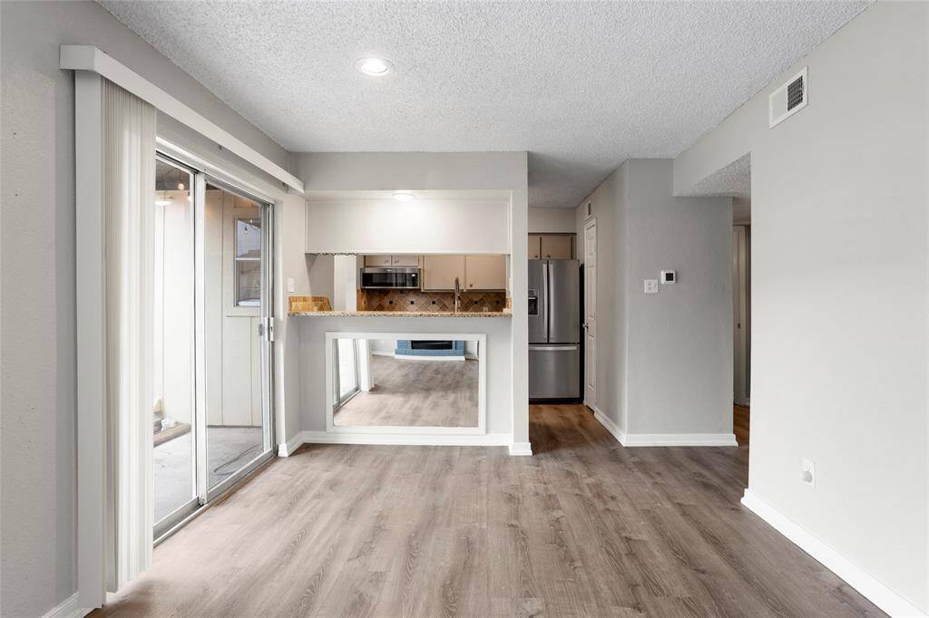 The dining area has a sliding door out to the patio.
