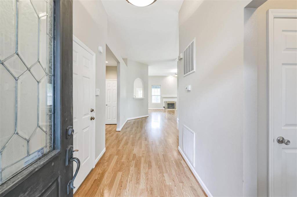 Foyer, home has laminate, tile , and new carpet in bedrooms
