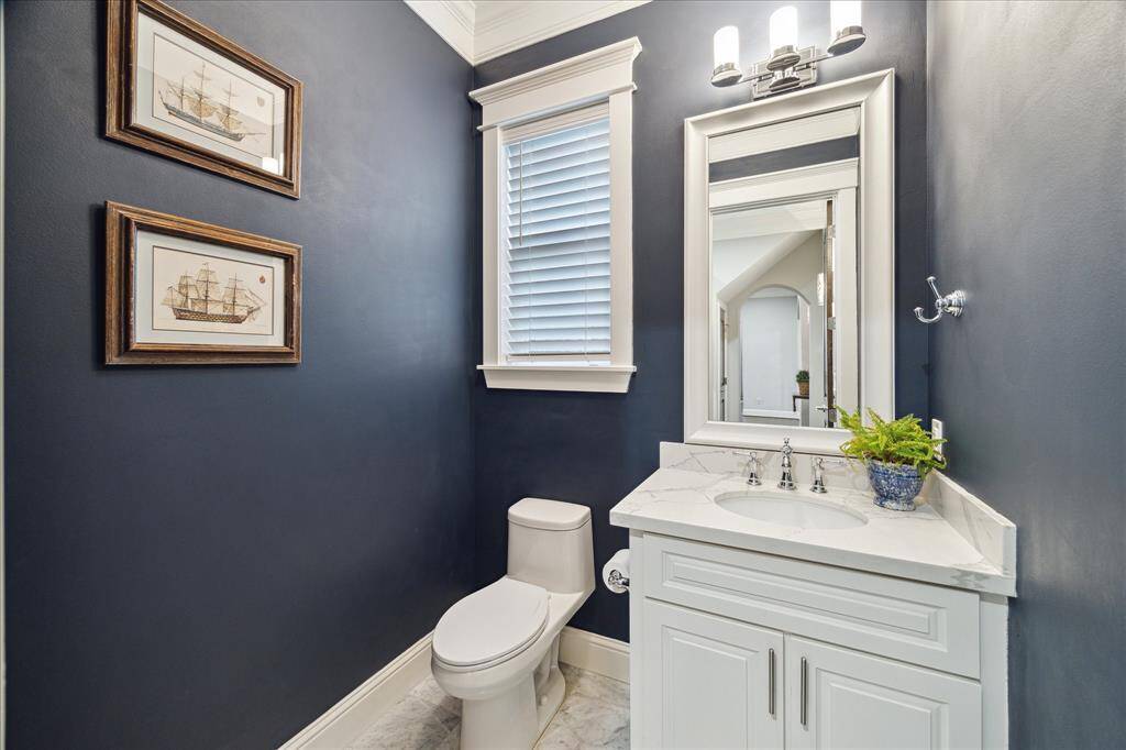The powder room is privately situated on the first floor.