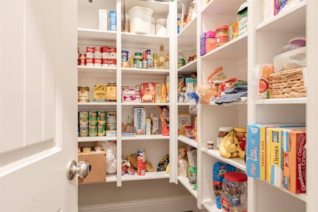 Generous walk-in pantry offers abundant storage and easy organization—perfect for keeping your kitchen clutter-free and essentials within reach.