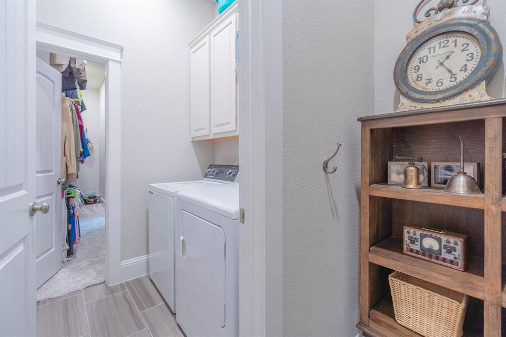 At the top of the stairs, a stunning built-in bookcase adds both charm and function—perfect for displaying books, decor, or family treasures.