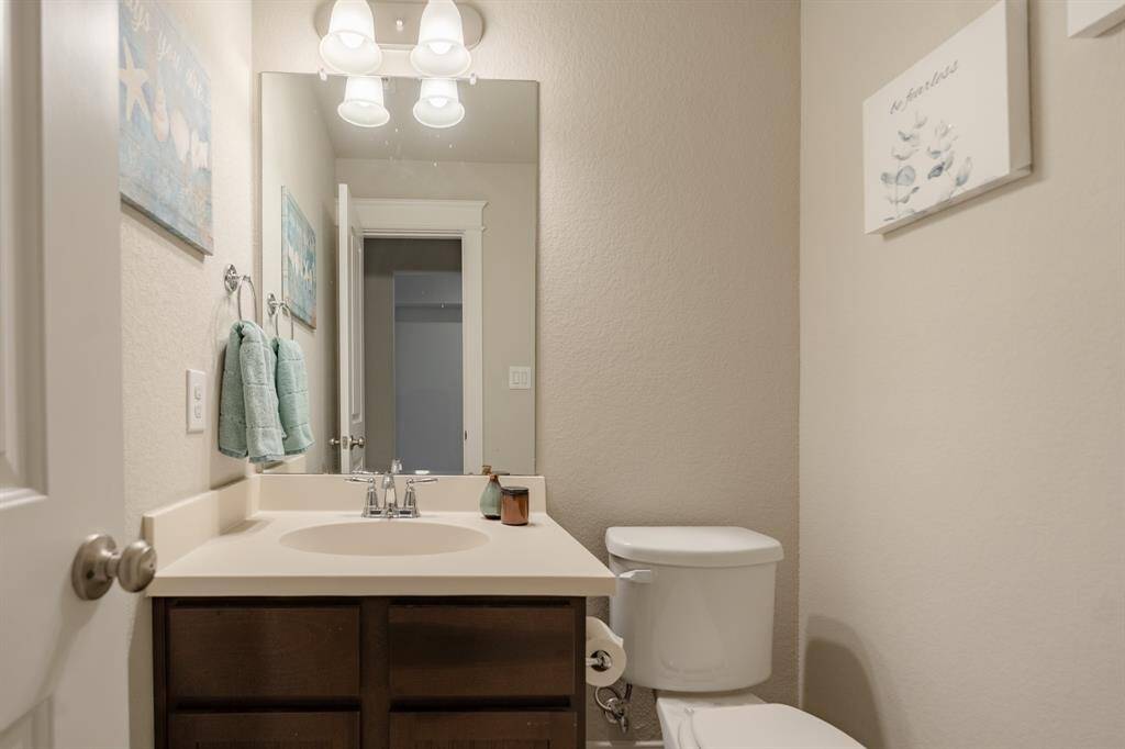Convenient half bathroom located just off the game room/media room—adding extra convenience for everyday living.