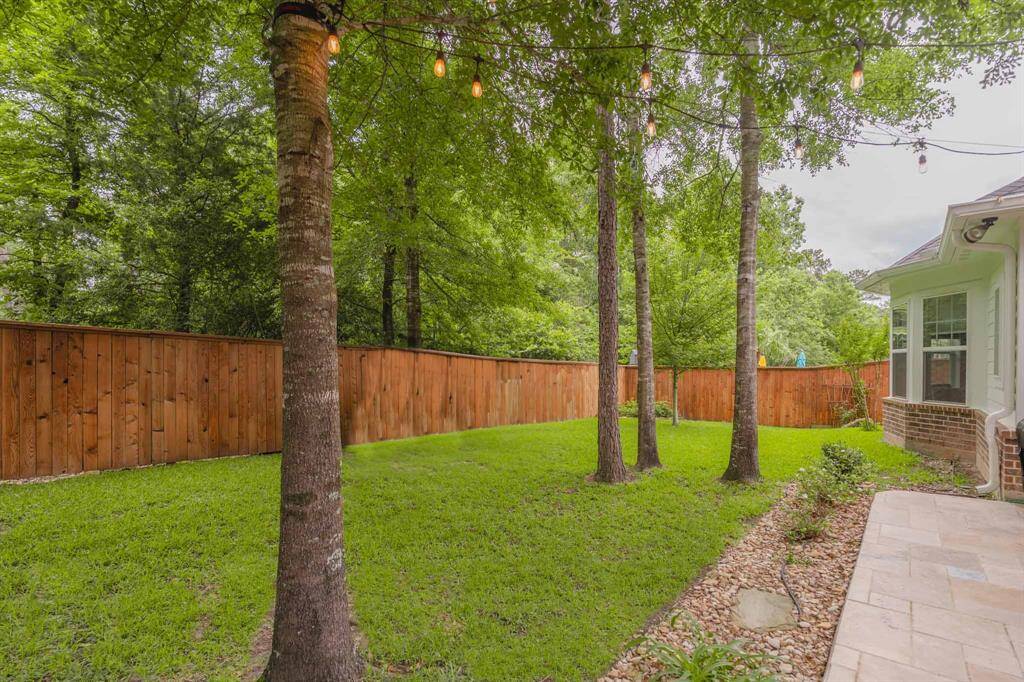 Ample backyard overlooking serene woods with no rear neighbors—offering privacy and a peaceful natural setting.