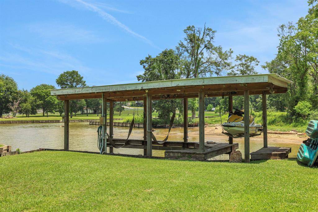 Small boat house with boat sling and jet ski lift