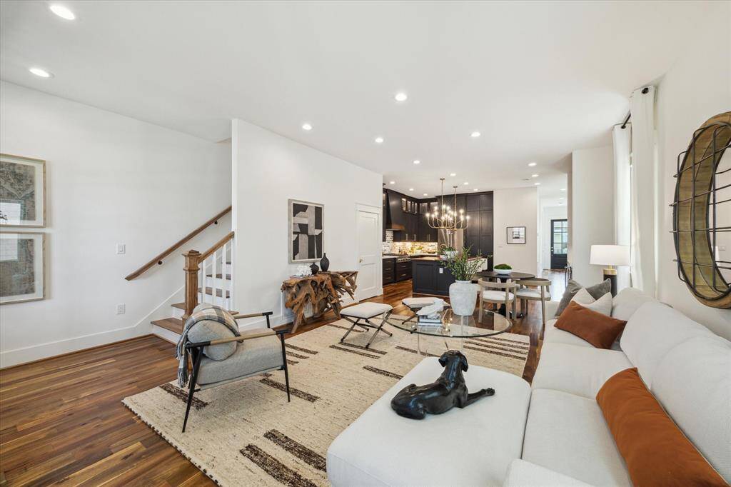 Open concept. Living area open to the dining area and kitchen. All hardwood floors. Abundant natural light.