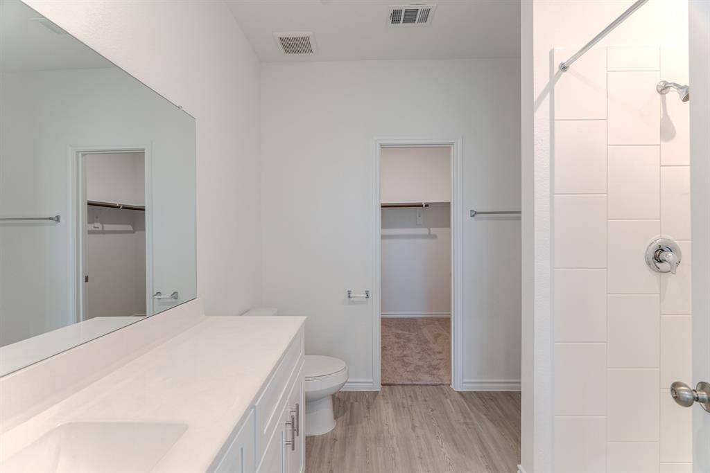 Walk-in closet from primary bedroom