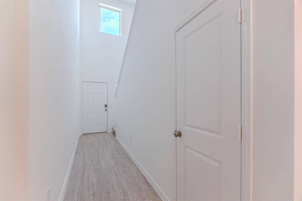 Entry hallway with a storage closet