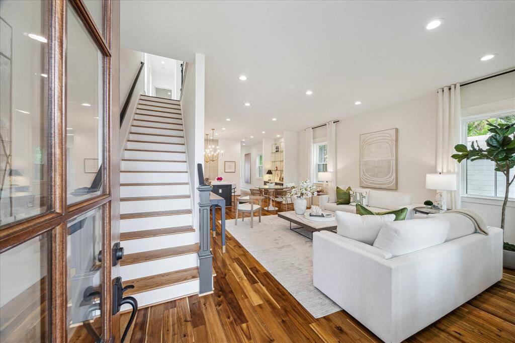 Open concept. Living area open to the dining and kitchen area. All hardwood floors. Abundant natural light.