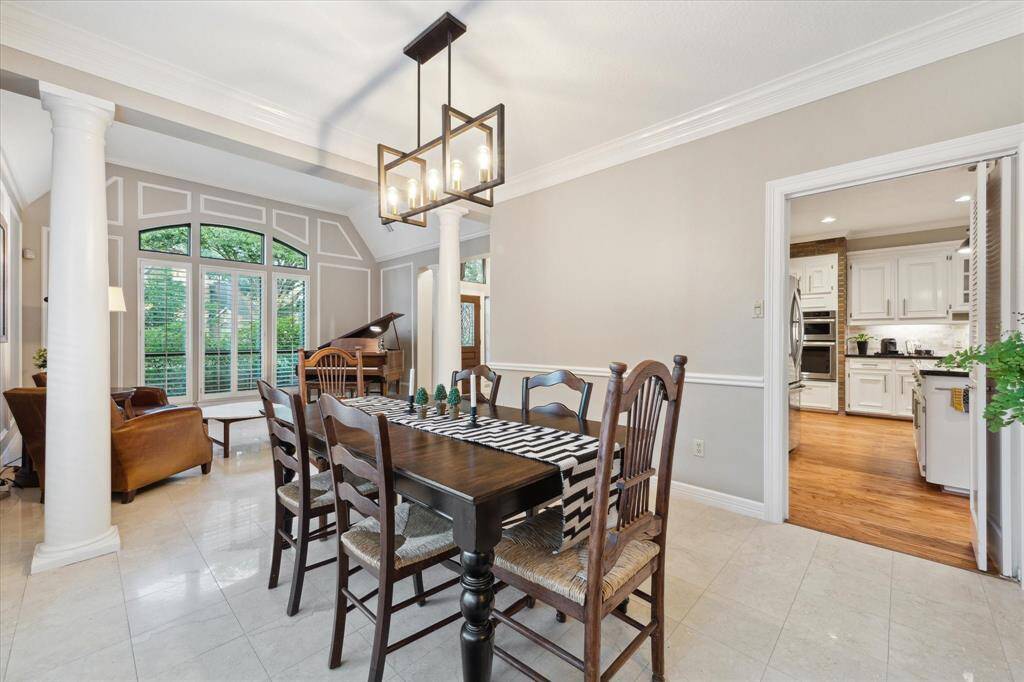 On the opposite side, the dining room is open to the kitchen. This makes serving and entertaining a breeze.
