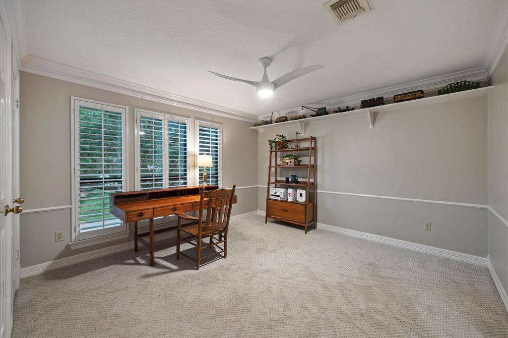 This generously sized room overlooks the mature tree in the front yard and also leads to a Jack and Jill bathroom.