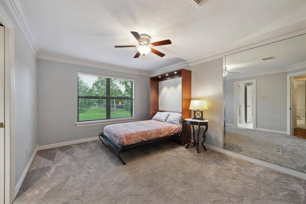 The third bedroom has a great view of the park and features a built-in Murphy bed making it an ideal flex space/guest room combination. This bedroom also has a spacious closet that leads to a floored, walk-in attic.