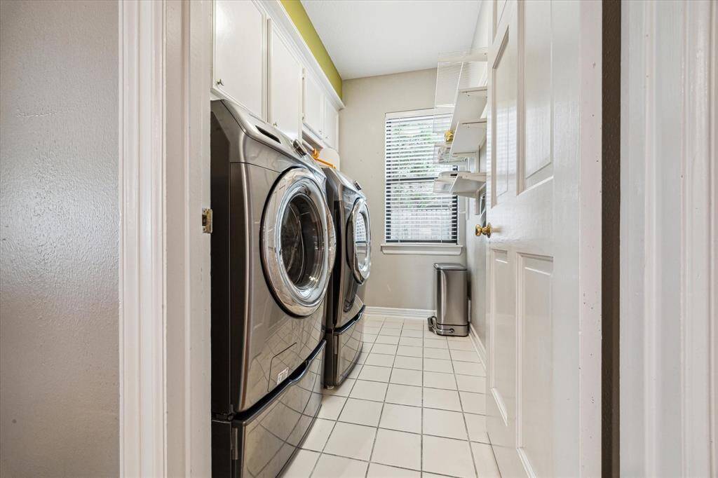 Located just off the kitchen, near the backdoor, the laundry room provides you with extra cabinetry and plenty of storage space.