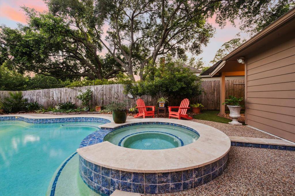 Notice the covered area behind the garage? This is where you'll find the pool equipment. It's nicely tucked away and out of the elements.