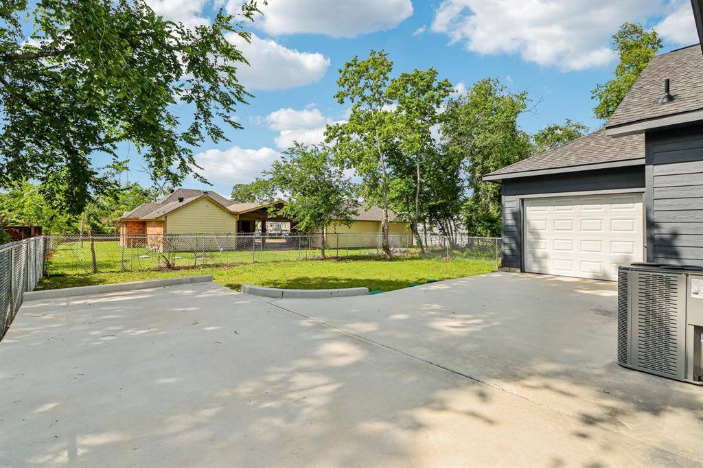 The driveway leads all the way to the spacious two-car garage.