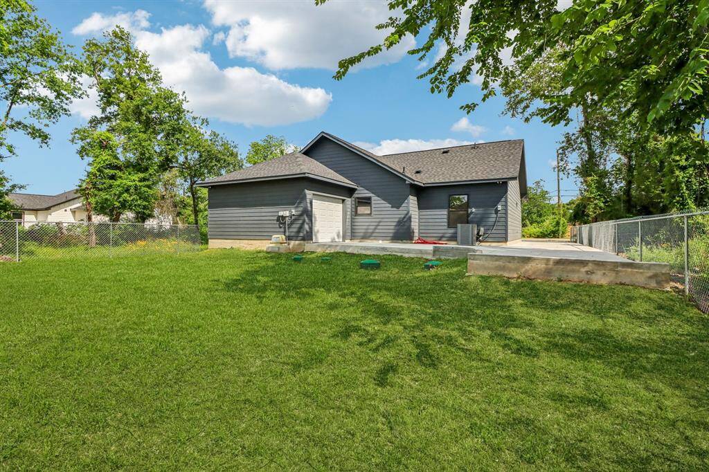 Here is the well-maintained back lawn, that is very spacious.