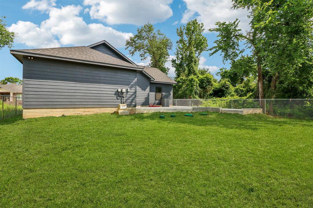 Beautiful plush green lawn flows from the front to the backyards.