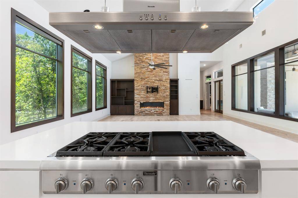 View from the kitchen while standing at kitchen Island with the Thermador gas cooktop and griddle.