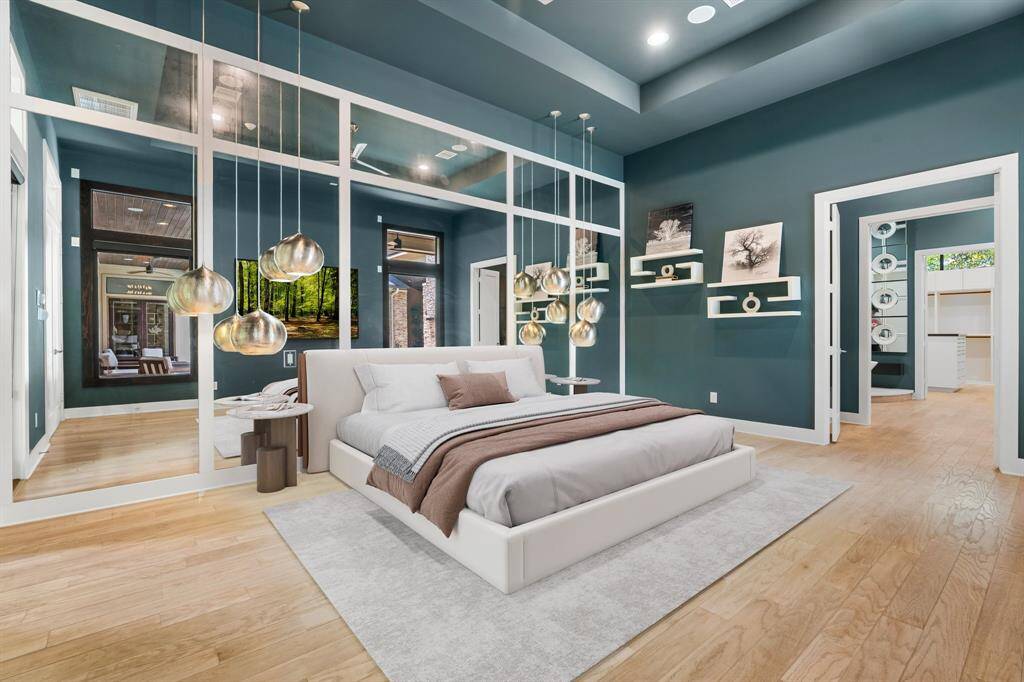 Primary Suite is stunning. Virtually staged to understand the size of this room! The entry to the bath is flanked with drawers and cabinets then steps into the dramatic spa bath and on to the breathtaking closet!