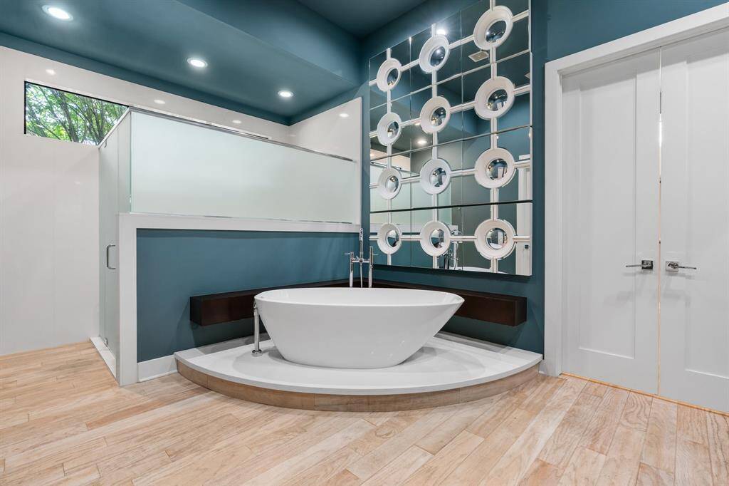 Primary Spa Bath is adorned with an oversized shower, jetted tub, custom bidet and double sinks!