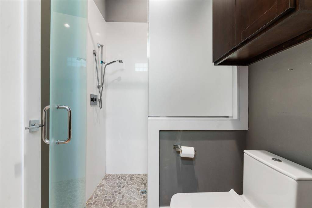 Glass enclosed shower.