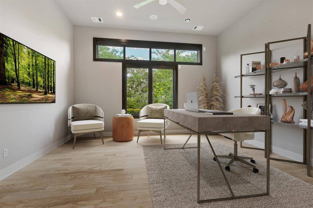 Guest Quarters in the garage is Virtually staged to show its possibility as a study or recreation room or another private, bedroom suite.