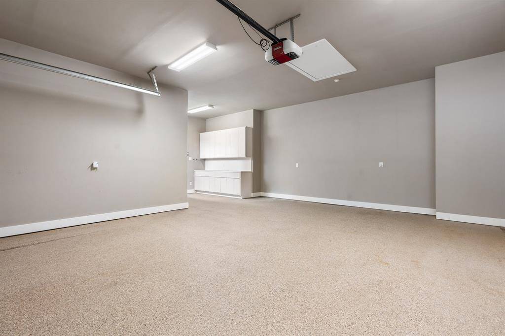 The 2nd garage is huge! There is a convenient storage/workshop area near the house entry door.