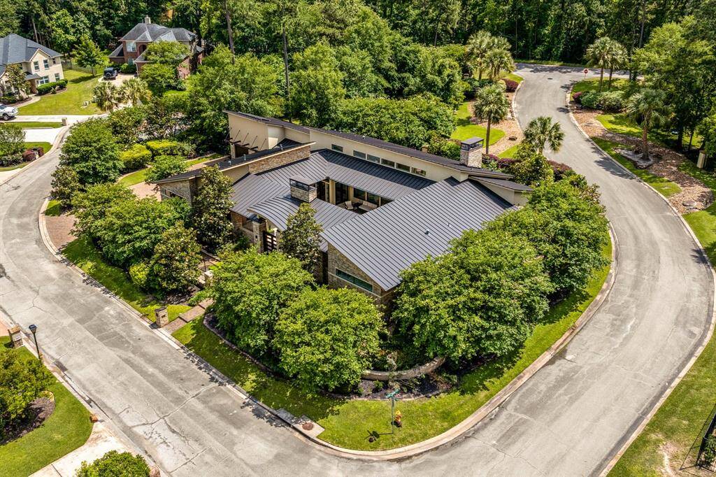 Another angle of this magnificent Modern home. The metal standing seam roof was replaced March of 2025. Energy is complete with a solar system and generator!