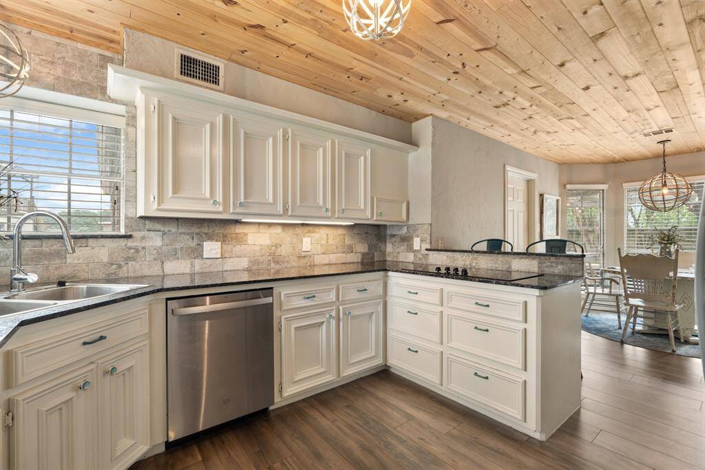 This kitchen will not disappoint! There is plenty of storage and counterspace making this kitchen every chef's dream! It opens to the breakfast nook and connects to the living room making it perfect to host any event or holiday!