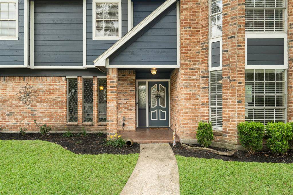 As you approach the front door, you are greeted by a warm brick elevation with contrasting accent paint and a spacious front porch—perfect for welcoming guests!