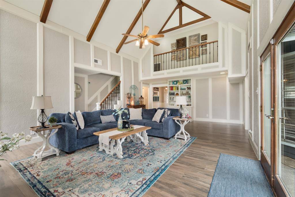 Whether it's a simple night in or entertaining family and friends, this home has ample open space for everyone to enjoy! Featuring a a cathedral ceiling, ceiling fan, wood look tile flooring, and access to the backyard!