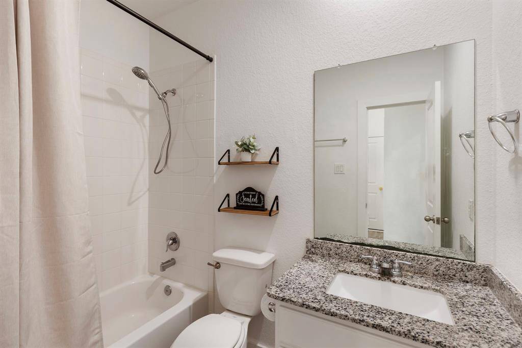 Another full bath is located near secondary bedroom #3 with access to the hallway!