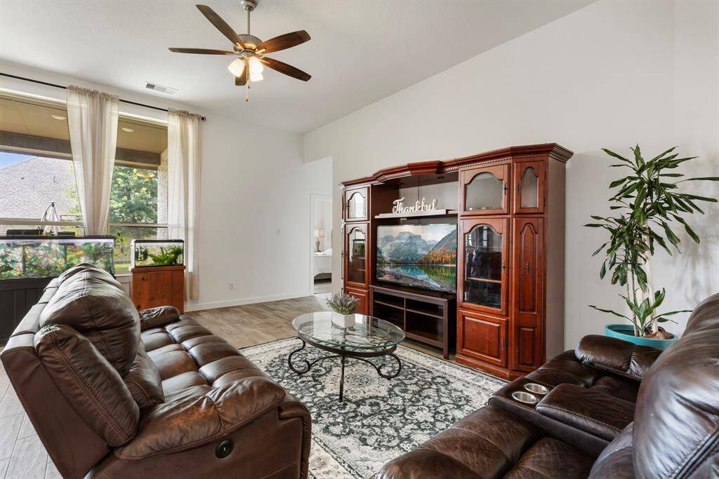 Two floor-to-ceiling windows add natural light to brighten up the room!