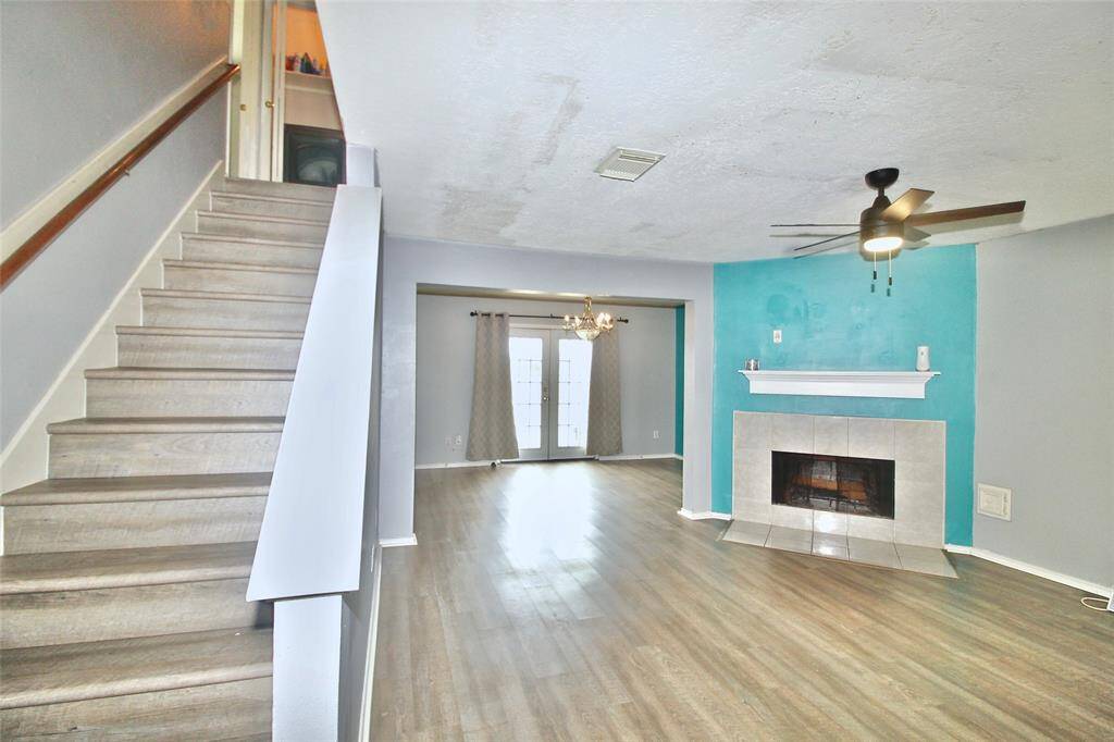 A view of the entrance with staircase leading to second floor