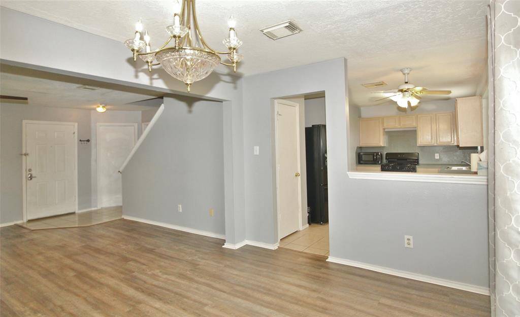 A different angle of the formal dining room overlooking the kitchen and living room
