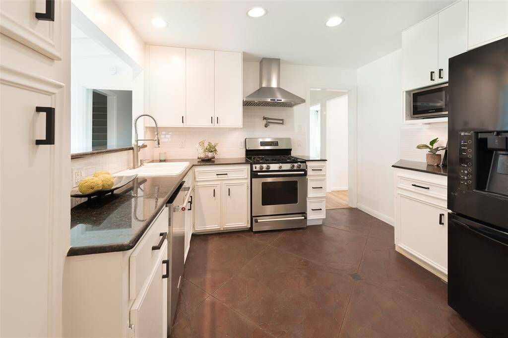 Kitchen open to family room and dining space.