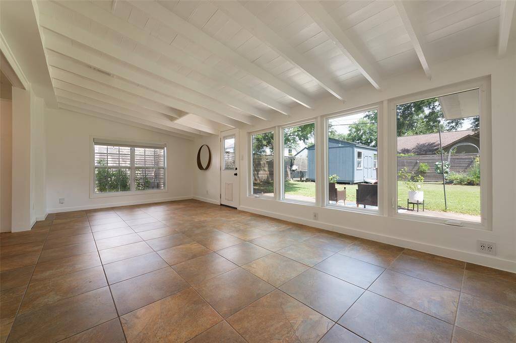 Large light filled family room with new double pane windows looking out on to beautiful back yard!