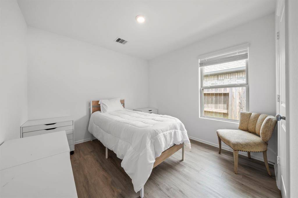 The three secondary bedrooms are all generously sized and feature stylish wood laminate floors.These versatile rooms are perfect for family and guests.