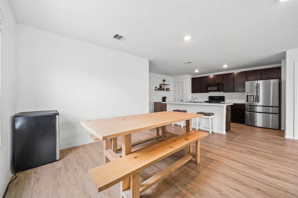 The dining area is thoughtfully combined with the kitchen and living room, creating a true open-concept layout.This design maximizes space and encourages easy flow for everyday living and entertaining.