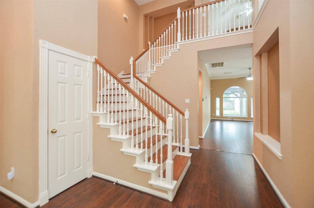This charming staircase provides a lovely view, as you walk straight through to the magnificent bright and open living/family area, ahead.