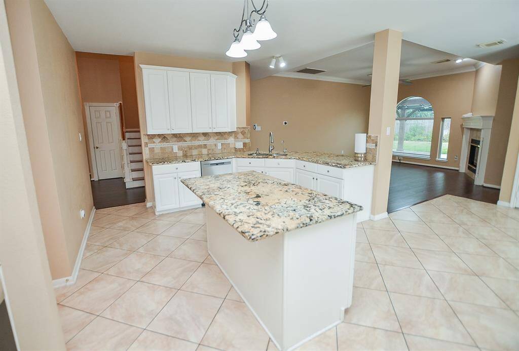(Note the second set of stairs conveniently landing in the kitchen/common area!