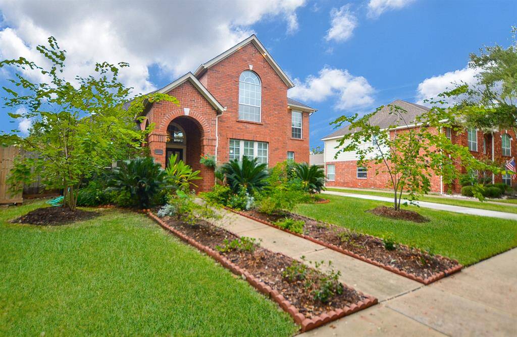 Carefully tended native greenery lines the pathway to your front door!