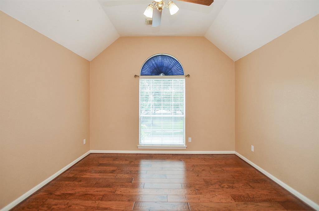 Another secondary bedroom welcomes both family and visiting guests.