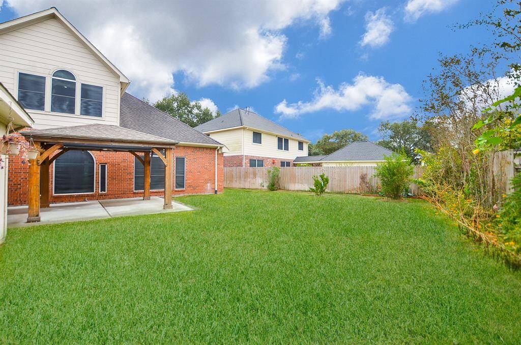Privacy fencing surrounds the entire back property for privacy and comfort.