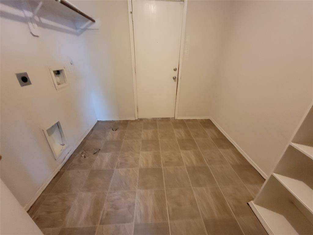 Versatile utility space designed for both pantry storage and laundry needs.