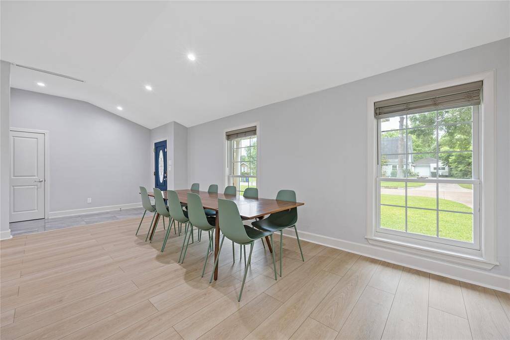 Second Angle of Dining & Entry AreaCaptures flow from entry to dining, with vaulted ceilings, recessed lighting, and modern wood flooring. A smart, functional design layout for modern living.