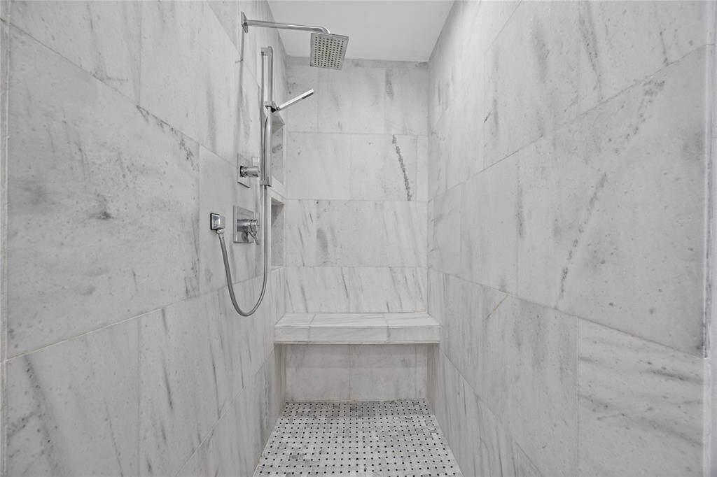 Walk-In Marble Shower with Rainhead, Handheld, and BenchStunning walk-in marble shower featuring a rainhead, handheld spray, inset shelving, and built-in bench—resort-level relaxation at home.