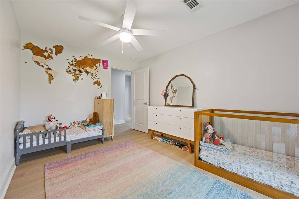 Another View of Nursery or Flex Room with Closet and FanNeutral walls and wide-plank floors provide the perfect backdrop for a variety of uses in this adaptable and peaceful room.