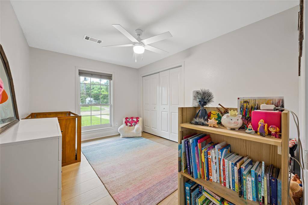 Secondary Bedroom Styled as Nursery with Large Window and ClosetFlexible and spacious, this room features upgraded floors, ceiling fan, and natural light—great as a nursery, guest room, or home office.