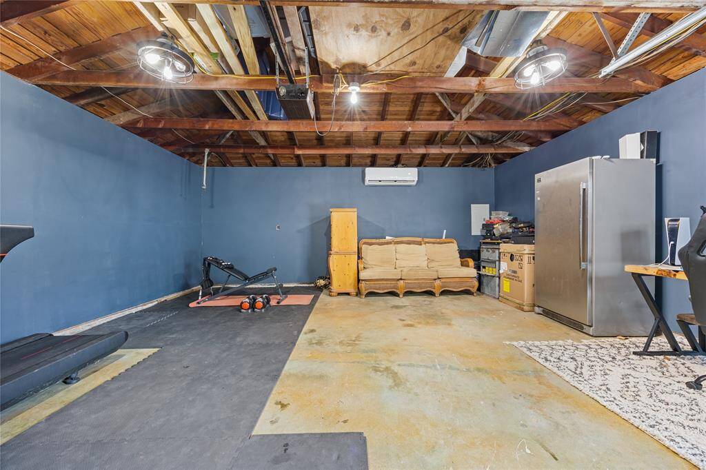 Multi-Use Bonus AreaMaximize utility with this bonus space, perfect for fitness, gaming, or weekend projects. Industrial lighting and wall-to-wall mats create a functional vibe that’s ideal for any lifestyle.