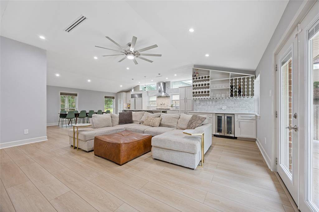 Open Living Area View Featuring Bar, Kitchen, and Lounge ZonesThis wide-angle shot captures the heart of the home, blending kitchen, bar, and living space seamlessly with a focus on natural flow and flexibility.